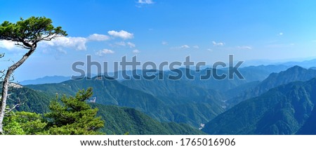 Panoramic scenery of the fresh green mountains seen from Daijyagura at Mt. Odaigaharayama, Nara