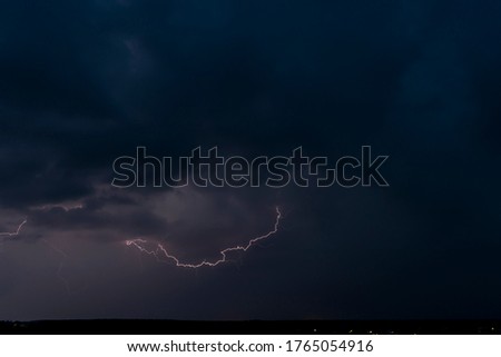 Lightnings in Summer Storm with Dramatic Clouds