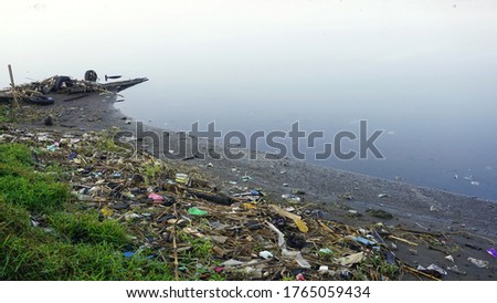 environmental pollution, garbage scattered on the beach