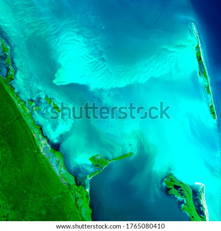 Aerial view Island Mujeres in Cancun Mexico. A beautiful color of turquoise blue and vegetation can be seen. Generated from image satellite sensor Sentinel of Copernicus.