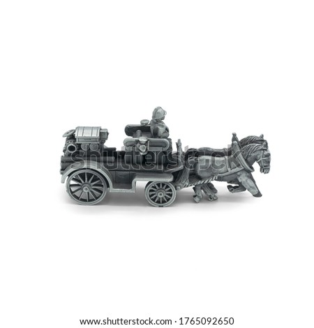 Children's toy fire carriage with horses close up on a white background