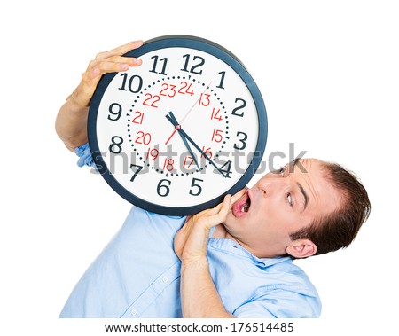 Closeup portrait of business man funny looking student holding clock stressed running out pressured by lack of time guy overwhelmed boy, late for meeting isolated on white background. Negative emotion