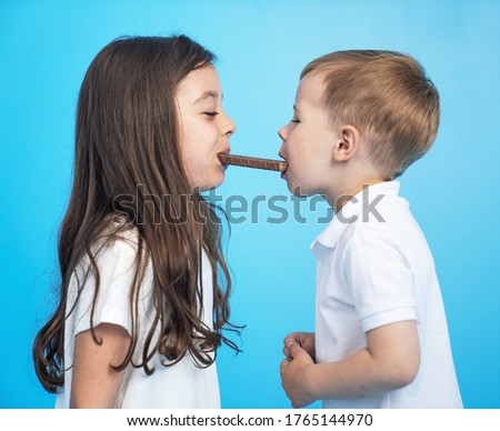 Funny picture of a kids eating a chocolate