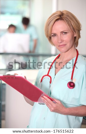 Blond nurse at work.