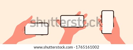 Hand holding mobile phone with white screen set in flat style isolated Royalty-Free Stock Photo #1765161002