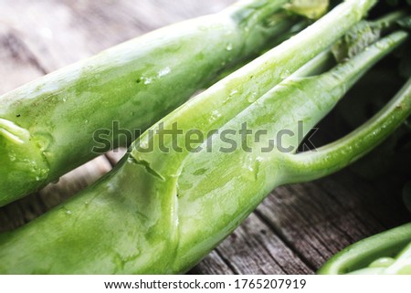 Fresh kale vegetable on wood background