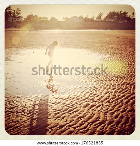 Little girl on beach instagram effect with frame
