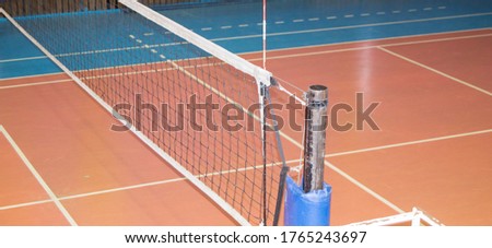 Modern empty school gym indoor with volleyball net Royalty-Free Stock Photo #1765243697