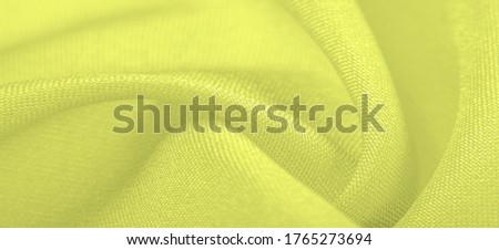 Background texture, Steel Yellow Silk Dupioni, Duppioni or Dupion This is a reversible, crisp, medium-density silk fabric with a fleecy texture and a loose smooth weave. It does not crumple