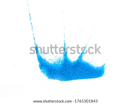 Abstract blue glitter powder and sand color splash or burst isolated on white background material design