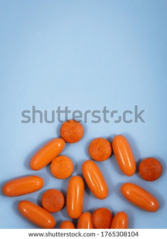 Arrange the orange tablets and capsules. Orange tablets and capsules out of the cover