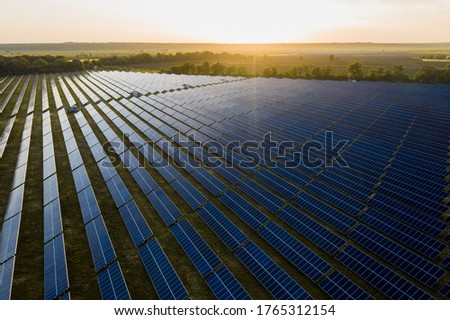 Aerial top view of a solar panels power plant. Modern technology, climate care, earth saving, renewable energy anti global warming concept Royalty-Free Stock Photo #1765312154