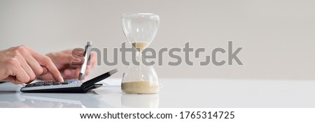 Late Invoice And Hourglass Deadline Working In Office