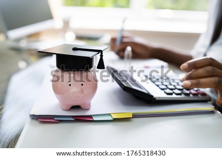 African American Women Accounting With Graduation Cap Royalty-Free Stock Photo #1765318430