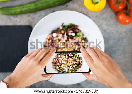 Close-up Of Woman Taking Picture Of Food With Mobile Phone