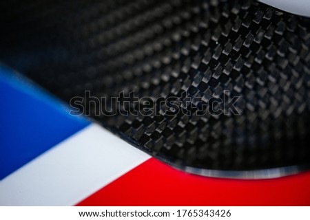 Blured detail of fiber carbon part of an Italian sports car