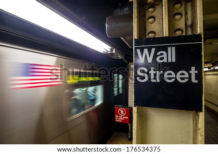 Wall street subway sign in New York City Manhattan station.