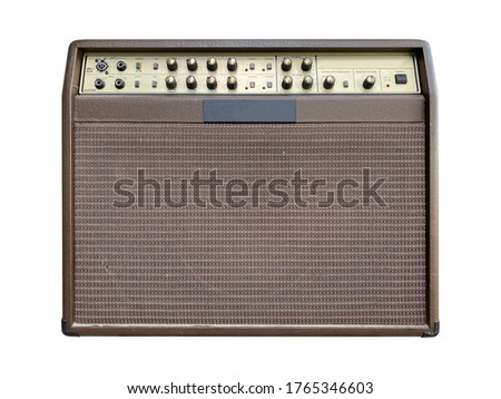 Isolated brown leather and gold control panel vintage acoustic guitar amplifier with black knob on white background with Clipping path. Popular amp in pop country music. front view photo.