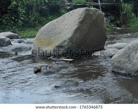 river water flow between the rocks. nature photo object          