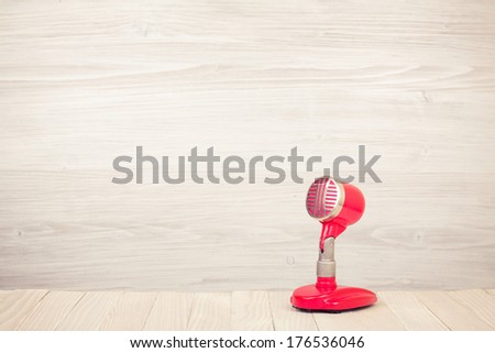 Retro red microphone on table