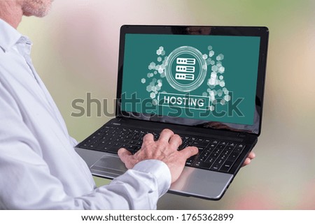 Man using a laptop with hosting concept on the screen