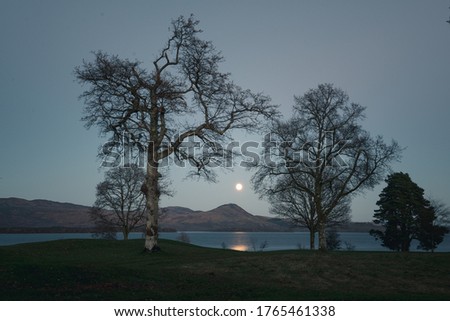 moon rising above conic hill