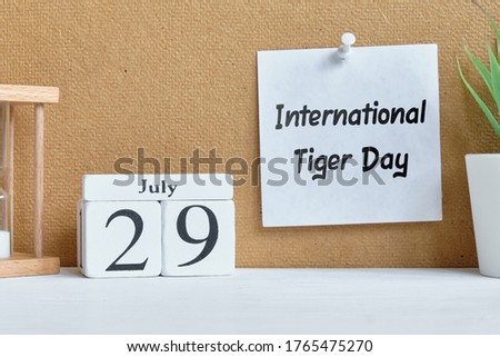 29th july month calendar on wooden blocks - International Tiger Day.
