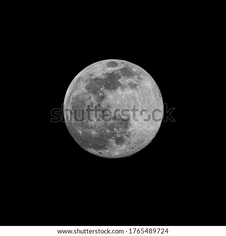 Large full moon seen in detail over the darkness of night