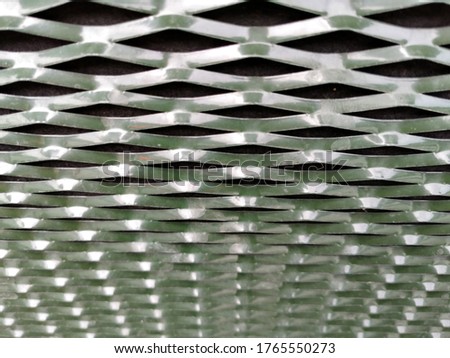 blured metal mesh grill. Perfect for background with soft focus