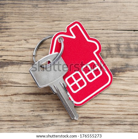 A key in a lock with house icon on it 