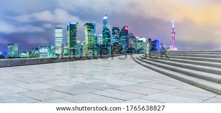 Empty square floor and Shanghai Lujiazui commercial building scenery at night,China.