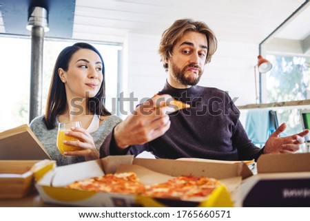 Family happy couple have pizza break while working at home together