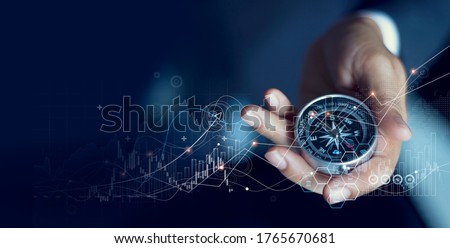 Business navigate recovery, Abstract, The compass navigate for businessmen to resume business growth in the economic crisis, Rethink, Reinvent and Recover. Royalty-Free Stock Photo #1765670681