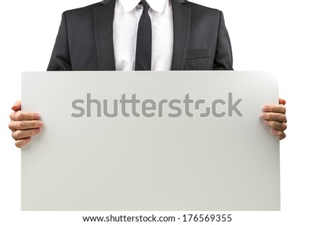 Businessman holding a blank white rectangular sign with copyspace for your text or advertisement, torso view closeup on his hands and the sign, isolated on white.
