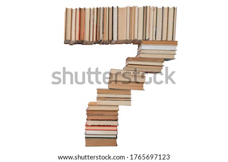 Number - 7 made of books isolated on white background. Digit shape mockup from the alphabet. Concept of education. Nobody