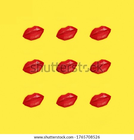 Romance concept with bright beauty red polygonal paper lips. Creative kiss. World Kissing Day greeting card. Flat lay.