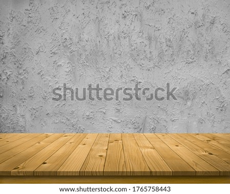Empty perspective brown plank wooden board as mock up display shelf or counter with abstract beautiful pattern and textured on flat cement wall in coffee shop and soft lighting background. 