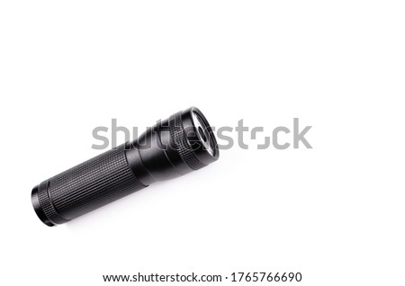 Black flashlight isolated on a white background