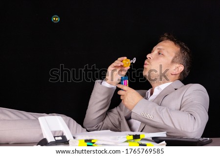 Concept businessman has nothing to do at work. All work is done. Royalty-Free Stock Photo #1765769585