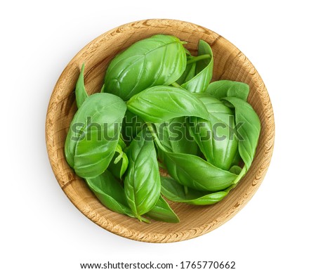 Fresh basil leaf in wooden bowl isolated on white background with clipping path and full depth of field. Top view. Flat lay Royalty-Free Stock Photo #1765770662