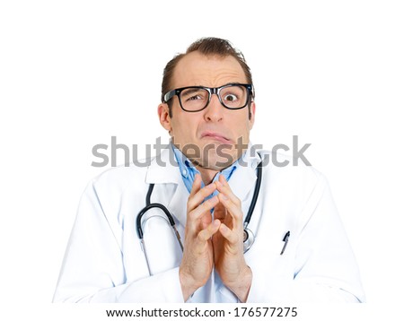 Closeup portrait of young insecure, crazy male doctor psychiatrist with black glasses looking funny, scared, craving, anxious isolated on white background. Human facial expressions, emotions, feelings
