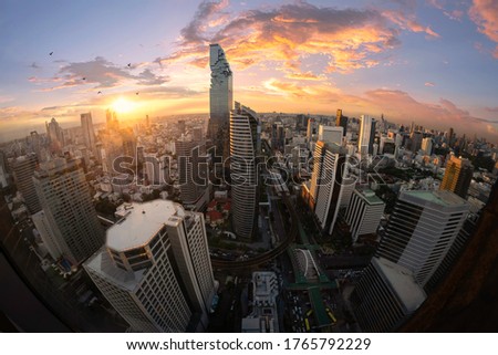 sunset rooftop view road to city, office buildings, living, condominium in Bangkok city skyline top view Downtown and business office bank financial in capital city of Thailand Asian 