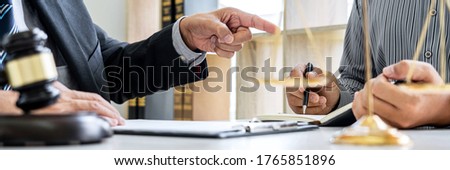 Male lawyer or Counselor working in courtroom have meeting with client are consultation with contract papers of real estate, Law and Legal services concept. Royalty-Free Stock Photo #1765851896