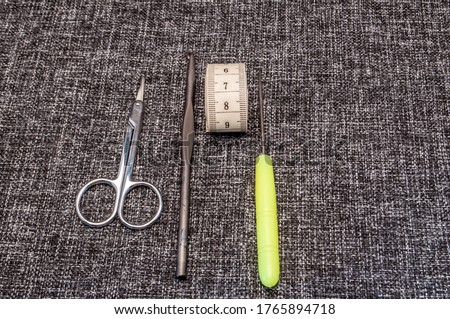 accessories for a seamstress on a gray background
