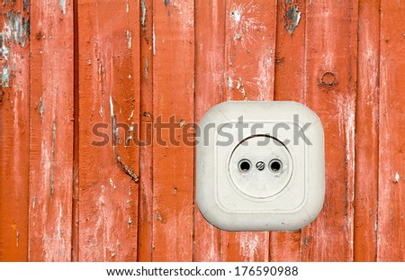 old white socket on a wooden background