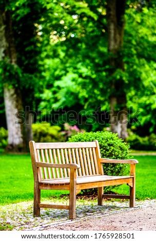 typical wooden park bench - photo Royalty-Free Stock Photo #1765928501