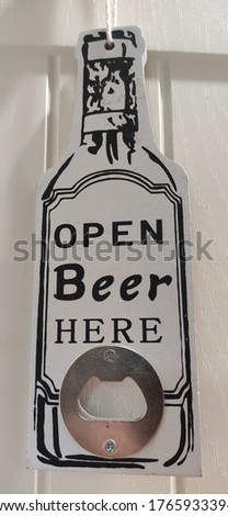 Souvenir bottles opener with drink.