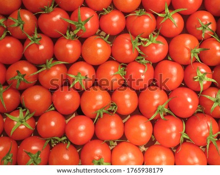 Red tomatoes in carton box as food background. healthy vegetables on display at store. Supermarket retail. Royalty-Free Stock Photo #1765938179