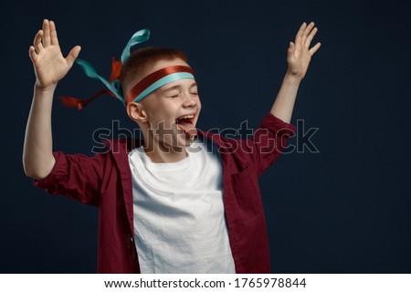 Little boy screams in studio, windy effect