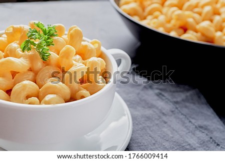 Close up of cooked macaroni pasta and vegan cheese sauce. Royalty-Free Stock Photo #1766009414
